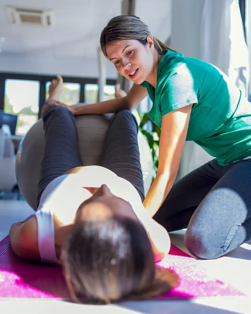 woman-with-instructor-works-on-pelvic-health-pt